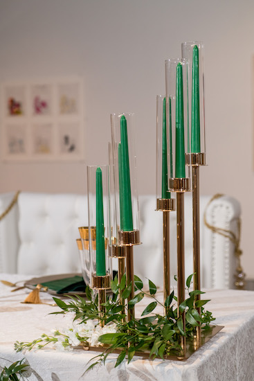 modern hunter green candles in a gold candelabra