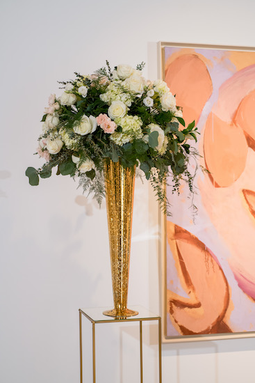 tall shimmering fold vases filled with greenery as ceremony structures in PAFA's Hamilton Building