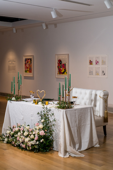 elegant hunter green and gold sweetheart table in PAFA's Hamilton Building