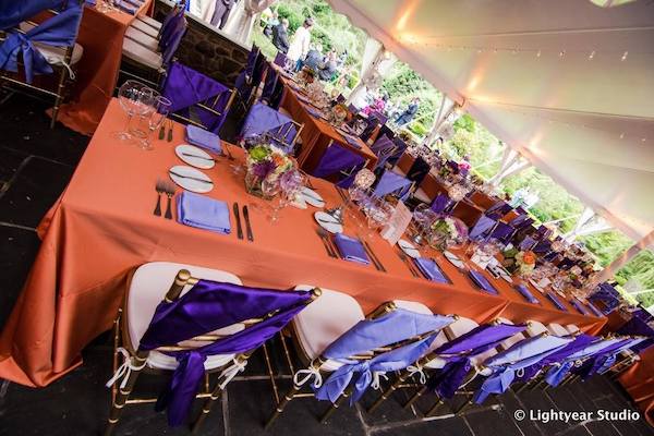 Philadelphia tented wedding reception in shades of purple and burnt orange