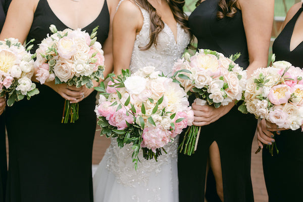 Philadelphia bride and bridesmaids with soft pink and white bouquets
