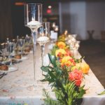 Elegant Events Florist - Philadelphia wedding florist - fall bridal bouquet - orange calla lily - yellow roses - mango calla lily - villanova conference center - villano pa - bg productions photography and videography - reception - head table - garland